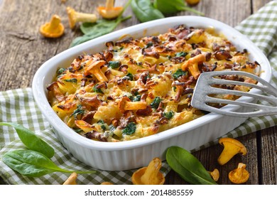 Chanterelle Pasta Casserole With Spinach Leaves And Cheese Served Hot From The Oven