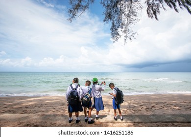 Chanthaburi, Thailand - MAY 30, 2011: A Group Of Thai Primary School Students In School Uniform Relaxing At Seaside During On A Field Trip To The Sea. Kung Krabaen.