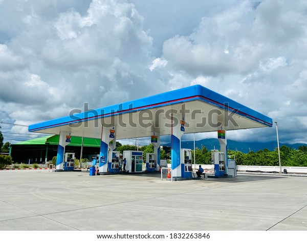Chanthaburi, Thailand - October 3,\
2020 : PTT gas fuel station with sky and clouds, service station\
for cars and motorcycles at Khitchakut mountain\
Chanthaburi