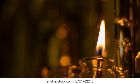 Chanukah Oil Candle On A Silver Menorah With One Candle Lit