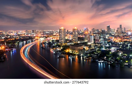 Chao Phraya river at nighttime bangkok city landscape, office buildings in bangkok city  skyline top view Downtown and business office bank financial in capital city of thailand asian   
