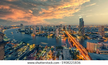 Chao Phraya river with sun raise and modern building ,Landscape of River in Bangkok city