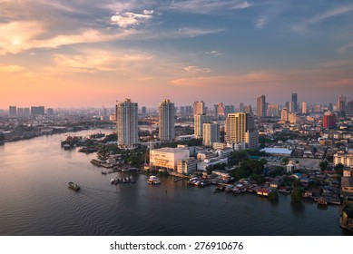 Chao Phraya River Sunset Sky, Office Buildings, Living, Condominium In Bangkok City  Skyline Top View Boat On The River, Downtown And Business Office Bank Financial In Capital City Of Thailand Asian 