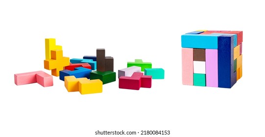 Chaos vs order concept. Multicolored puzzle toy elements and blocks arranged in cube isolated on white background. Wooden kids game for logical thinking development. High quality photo