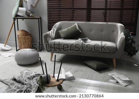 Chaotic living room interior after strong earthquake
