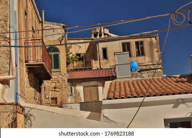 Chaotic Scene Of Italian Village Buildings And Electric Wires.