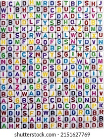 Chaotic set of colorful letters of the English alphabet. Lots of colorful letters in rows and columns