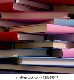 chaotic stack of old books background, selective focus