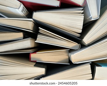 A chaotic yet charming collection of stacked books - Powered by Shutterstock