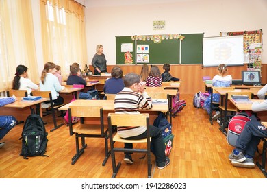 Chapaevsk, Samara region, Russia - January 23, 2021: Schoolkids in the classroom sitting at their desks and listen to the teacher