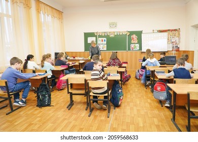 Chapaevsk, Samara region, Russia - January 23, 2021: Schoolkids in the classroom sitting at their desks and listen to the teacher