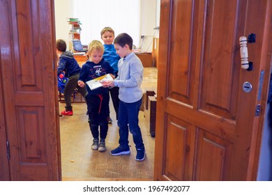 CHAPAEVSK, SAMARA REGION, RUSSIA - May 03, 2021: Primary schoolchildren play during recess at school. View through the front door of the classroom