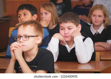 CHAPAEVSK, SAMARA REGION, RUSSIA - OCTOBER 24, 2018: School kids in the classroom sitting at their desks and listen to the teacher