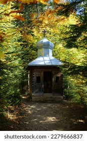 Chapel by Blessed Stone and sacred spring in forest near Manyava Skete in Western Ukraine, regarded as place of prayer and of spiritual purification. Spring of healing water emits from underneath it - Shutterstock ID 2279666837