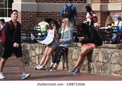 Chapel Hill,NC/United States- 02/06/2019: A Sorority Girl At UNC-Chapel Hill Holds Up A Sign For A Social Function. 