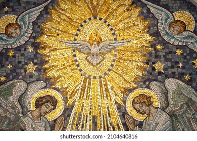 Chapel of Our Lady of the Miraculous Medal. The Holy Spirit hovers in radiant light, between two adoring angels.  France.  - Shutterstock ID 2104640816