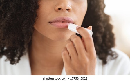 Chapped Lips Remedies. Black Woman Applying Chapstick Moisturizing Lip Balm, Cropped Image, Closeup - Shutterstock ID 1775845022