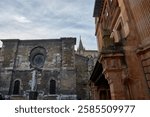The Chapter House of Oviedo Cathedral is an architectural gem showcasing a blend of Romanesque and Gothic styles. The façade, built with weathered stone, features a circular rose window 