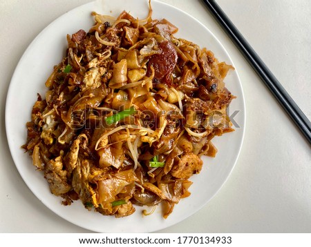 Char Koay Teow: Malaysian style stir fry flat noodles with bean sprouts  