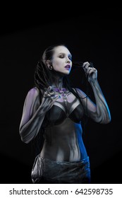 Character for computer game
Body painting cyborg, woman with pattern on body on black background - Shutterstock ID 642598735