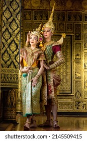 The character Phra Ram and Nang Srida dancing in a Thai pantomime performance. In the role of Rama Standing at the house of ancient Thai style, golden beauty house (a public place)