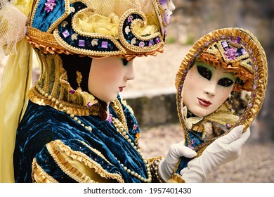 Character Of A Venetian Carnival Who Looks In A Mirror