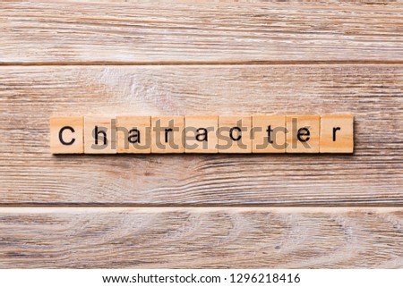CHARACTER word written on wood block. CHARACTER text on wooden table for your desing, concept.