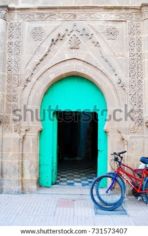 Characteristic bright green front door in Morocco