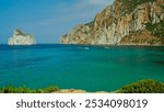 The characteristic rock called Pan di Zucchero off the coast of Sulcis Iglesiense. Porto Flavia, province of South Sardinia, Italy