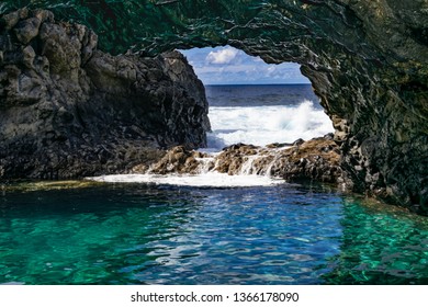 Charco Azul Volcanic Cavern, Natural Volcanic Ocean Pool With Turquoise Ocean Water In A Volcanic Cavern, With Sunlight And Atlantic Ocean Background, Frontera, El Hierro, Canary Islands, Spain