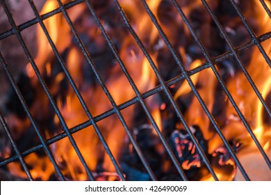 charcoal bbq flames and grid empty background, copy space