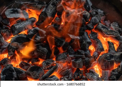 Charcoal is burning red and smoke