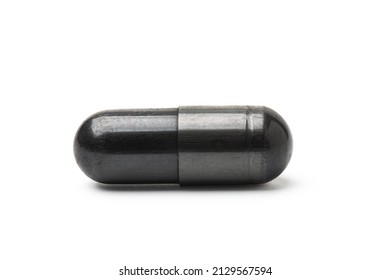 Charcoal capsule isolated on white background