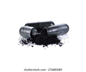 Charcoal capsules isolated on white background