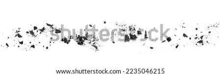 Charcoal dust scattered isolated on a white background, top view. Wooden charcoal. Black coal powder.