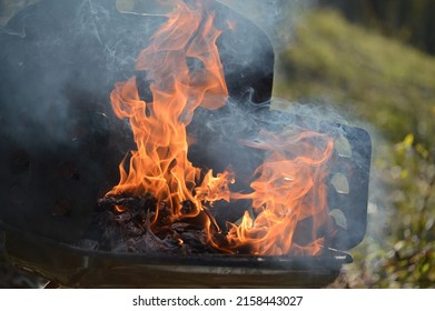 Charcoal Grill Closeup. Fire Flame. Summer Season. Precautionary Measures. 