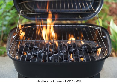 Charcoal Grill And Flames Close Up