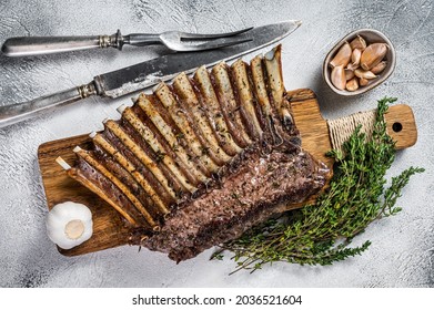 Charcoal Grilled French Rack Of Lamb Ribs Chops On Cutting Board. White Background. Top View