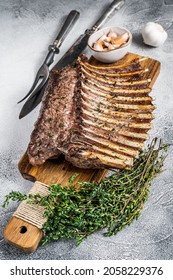 Charcoal Grilled French Rack Of Lamb Ribs Chops On Cutting Board. White Background. Top View