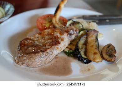 Charcoal Grilled Pork Sirloin Steak With Roasted Potato Oven Baked Tomato