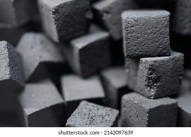 Charcoal for hookah. charcoal for hookah in the form of cubes. Coal for hookah in the form of a cube. The texture of cubes of coal close-up.