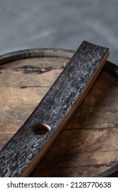 Charcoal Inside Of Barrel Stave Sitting On Top Of Wooden Bourbon Whiskey Barrel