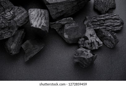 Charcoal on black floor