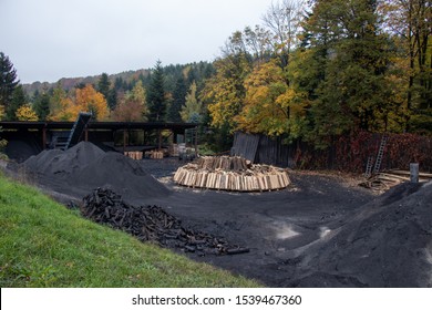 Charcoal pile prepared for churning