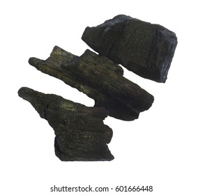 Charcole Cooking isolate in white Background.Three pieces of natural charcoal isolated on a white background. The rough texture and deep black color highlight its organic composition,