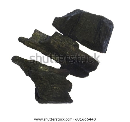 Charcole Cooking isolate in white Background.Three pieces of natural charcoal isolated on a white background. The rough texture and deep black color highlight its organic composition,