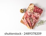 Charcuterie board. Antipasti appetizers of meat platter with salami, prosciutto crudo or jamon and olives.