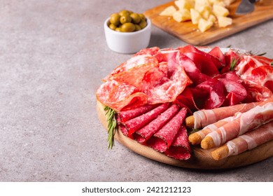 Charcuterie board. Antipasti appetizers of meat platter with salami, prosciutto crudo or jamon and olives. - Powered by Shutterstock