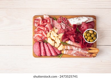Charcuterie board. Antipasti appetizers of meat and cheese platter with salami, prosciutto crudo or jamon and olives - Powered by Shutterstock