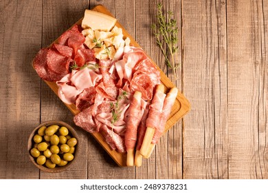 Charcuterie board. Antipasti appetizers of meat platter with salami, prosciutto crudo or jamon and olives. - Powered by Shutterstock